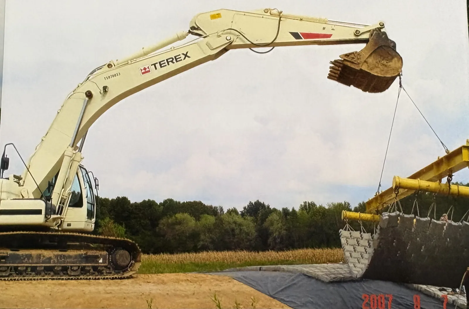 A Terex excavator setting a curved articulated block mat, 2007