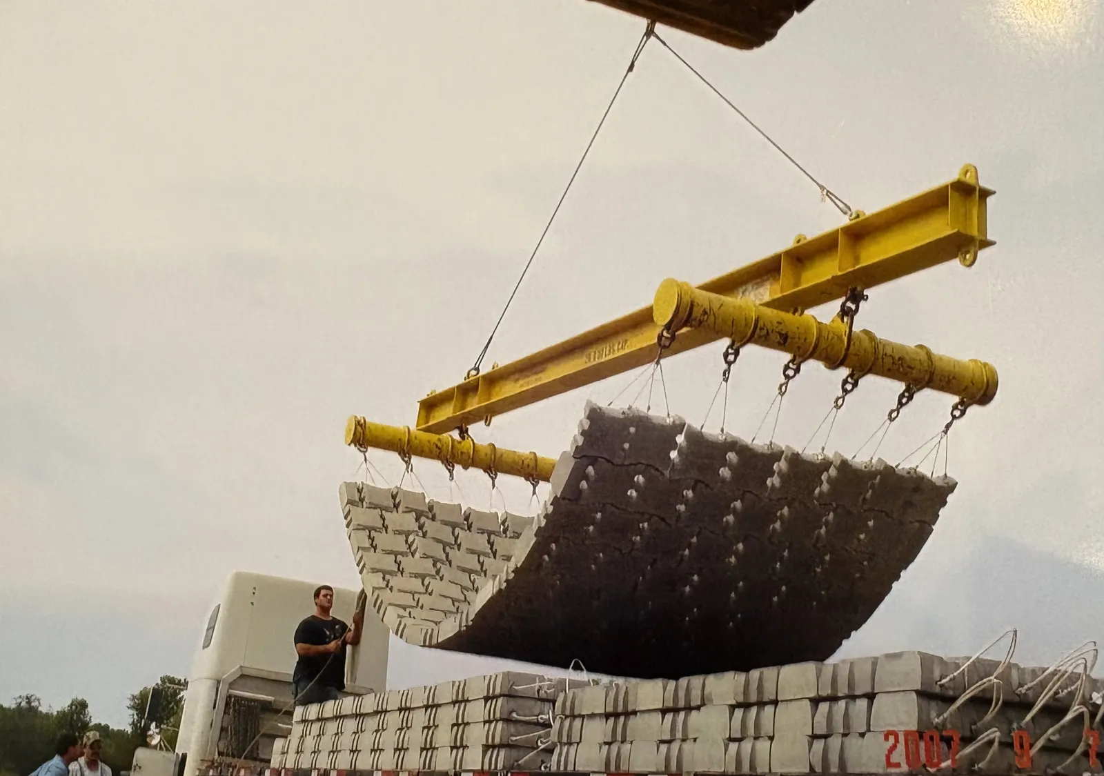 A spreader bar lifting an articulated concrete block mat into place, 2007